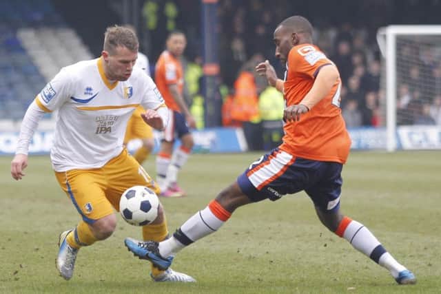 Louis Briscoe skips past Luton's Lathaniel Rowe-Turner -Pic by:Richard Parkes