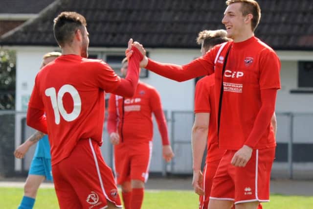 Two more goals for AFC Mansfields talismanic striker Ollie Fearon (right).