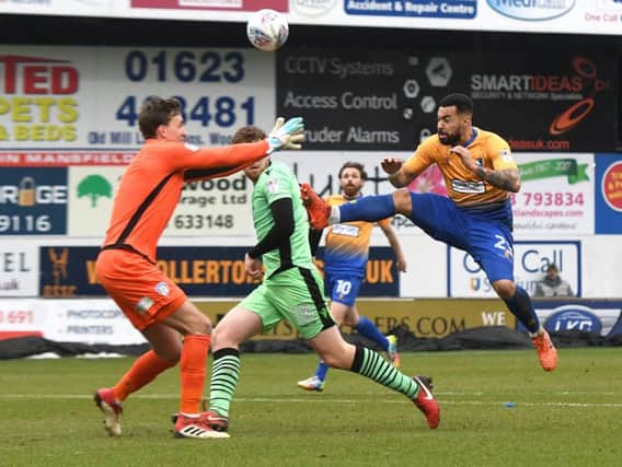 Kane Hemmings challenges the goalkeeper to score for Stags.