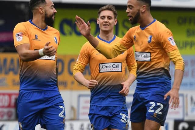 Kane Hemmings (left) is congratulated on his goal.