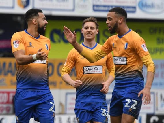 Kane Hemmings (left) is congratulated on his goal.