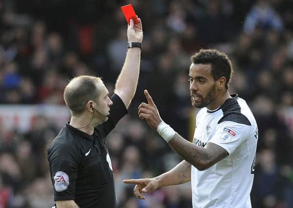 IN PICTURE: Tom Huddlestone is show the red card.
STORY: SPORT LEAD: Nottingham Forest v Derby County.  Sky Bet Championship match at The City Ground, Nottingham.  Sunday 11th March 2018.