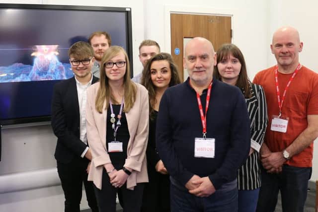 Interactive and creative digital media students pictured with Colin Hall (third right) and brother David (right).