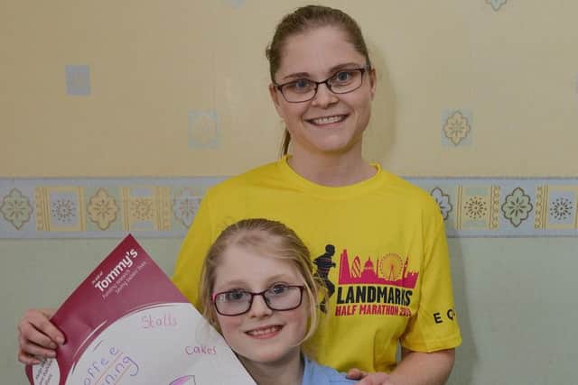 Sarah Windibank is taking a half marathon in aid of Tommy's charity. Sarah is pictured with daughter Carys, 10 who has been helping make charity posters