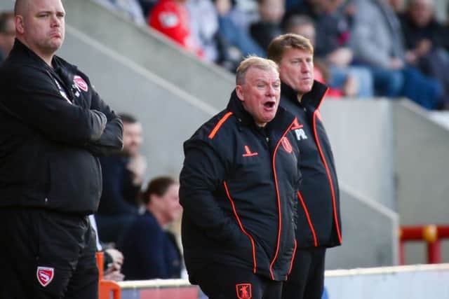 Mansfield Town's Manager Steve Evans and his assistant Paul Raynor - Photo by Chris Holloway