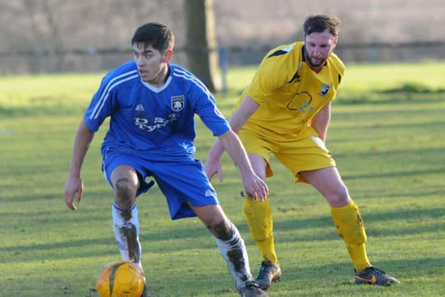 Khyle Sargent (blue), who scored the only goal of the game for Teversal in their win over Holbrook Sports.