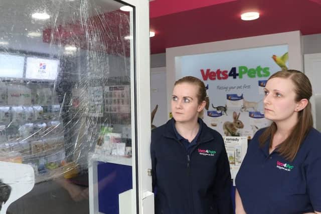 Partners Claire Matan and Stephanie Smith survey the damage after the latest of three attempted break ins at their vet surgery