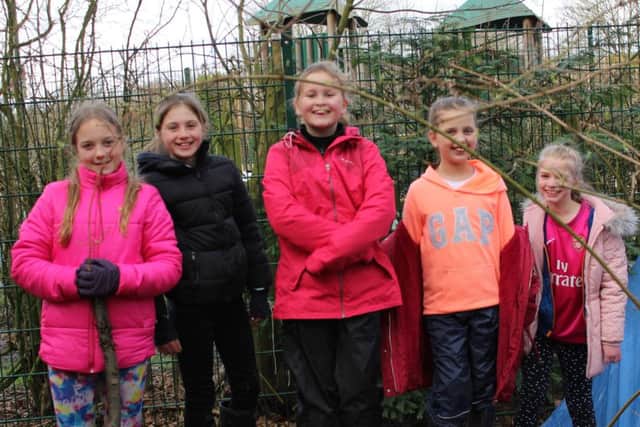 Some of the youngsters who took part in the tree-planting project.
