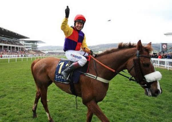 Champion jockey Richard Johnson salutes the crowd after winning the Timico Cheltenham Gold Cup on Native River. (PHOTO BY: Mike Egerton/PAWire/PA Images)