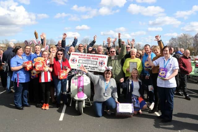 Mansfield road runners hand over the Â£2500-00 cheque to hospital staff.