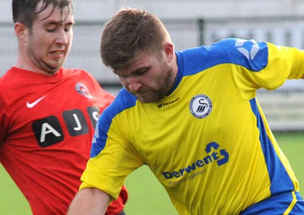 Guy Wilding, pictured here in action for Swanwick (yellow shirt) against Eastwood CFC, made his Selston debut on Wednesday night
