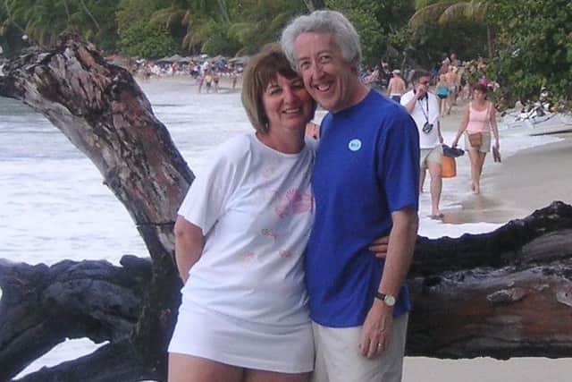 Mike Farley with his late wife, Cazi, on a beach while on holiday in the Caribbean.