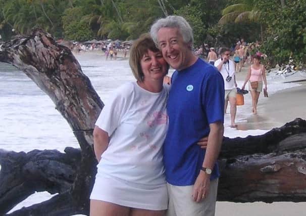 Mike Farley with his late wife, Cazi, on a beach while on holiday in the Caribbean.