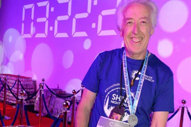 Mike Farley at the finishing line after one of his previous walks in the Shine Night Marathon in London.