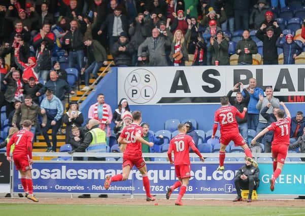 Accrington Stanley celebrate their goal with their travelling fans