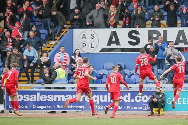 Accrington Stanley celebrate their goal with their travelling fans