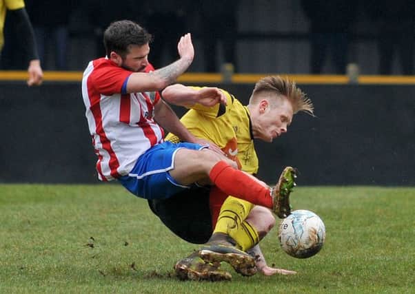 A crunch clash in a crunch match between title-chasing duo Hucknall Town and Sherwood Colliery. (PHOTO BY: Rachel Atkins)