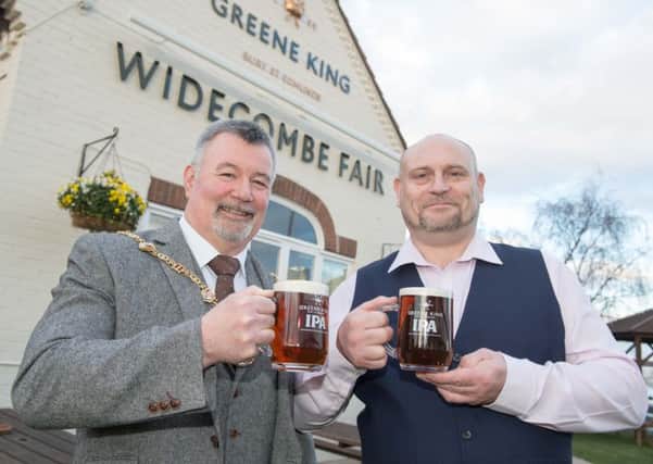 A toast to the new-look Widecombe Fair from council chairman, Coun Kevin Brown (left), and manager Terry Titley.