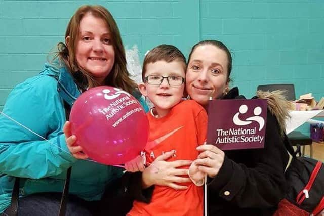Mums and a youngster at the family fun day to raise awareness of autism. )