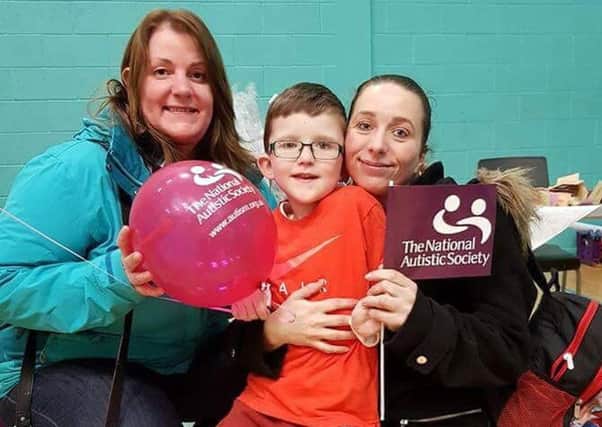 Mums and a youngster at the family fun day to raise awareness of autism. )