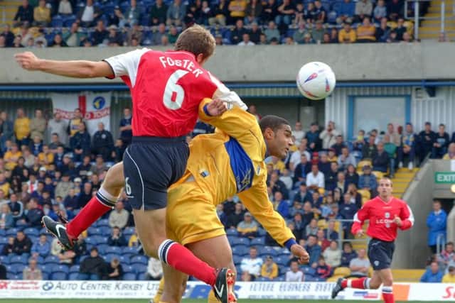 Stephen Foster gets airborne for Crewe.