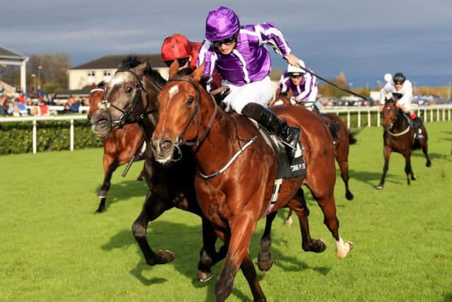 Saxon Warrior wins the Racing Post Trophy at Doncaster for trainer Aidan O'Brien and jockey Ryan Moore.