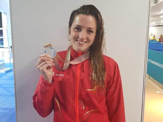 Molly Renshaw with her silver medal. Photo: Twitter/@swim_england