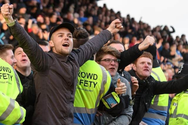 Chesterfield fans celebrate a goal.