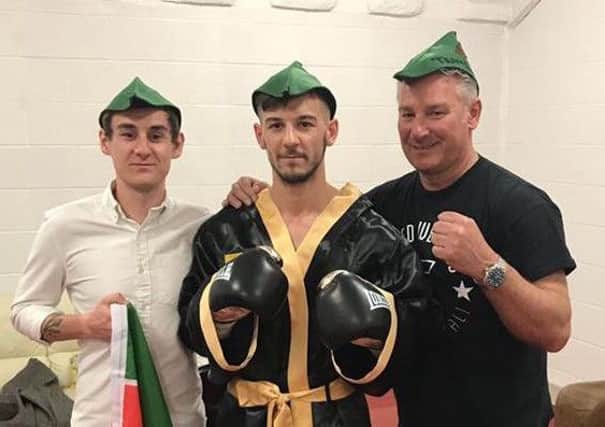 Ben Eland (centre) sporting one of the Robin Hood hats that his fans wore at the Ultimate Boxxer event in Manchester.