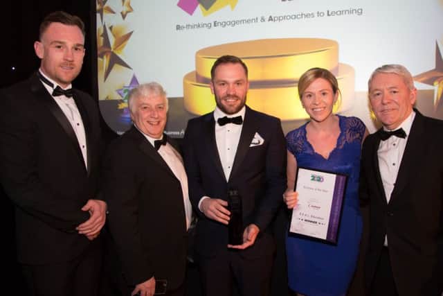 Representatives from R.E.A.L. Education with their prestigious award for Business Of The Year.