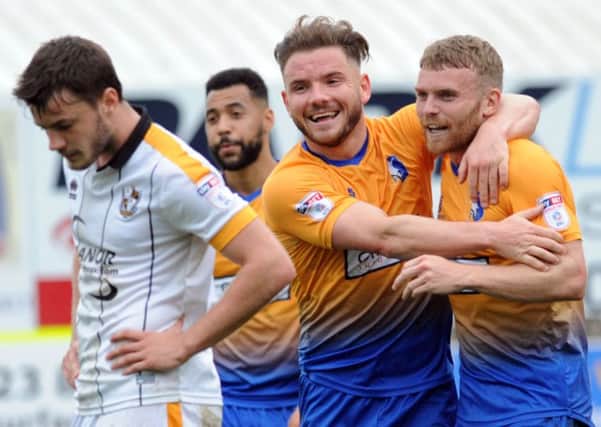 Mansfield Town v Port Vale.   
Alex MacDonald and Alfie Potter's joy was short lived in the second half.