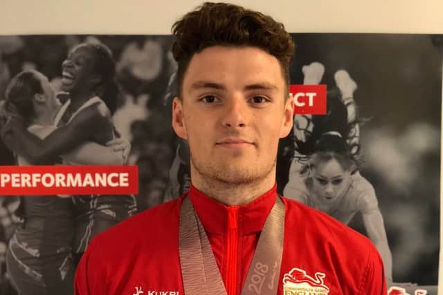 Proud teenager Elliot Clogg with the two silver medals he won at the Commonwealth Games.