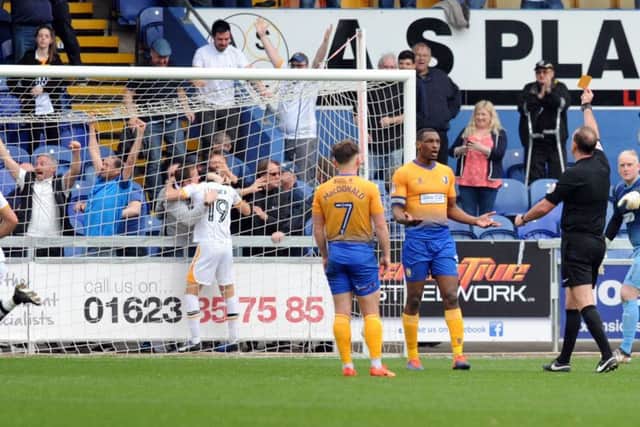 Mansfield Town v Port Vale.   Krystian Pearce is yellow carded after Port Vale's equaliser.