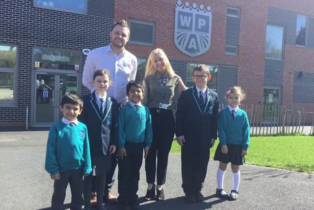 Mansfield MP Ben Bradley with staff and pupils from Wainwright Academy