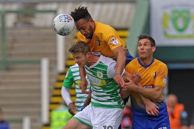 Picture by Gareth Williams/AHPIX.com; Football; Sky Bet League Two; Yeovil Town v Mansfield Town; 28/4/18  KO 15:00; Huish Park; copyright picture; Howard Roe/AHPIX.com; Stags' Rhys Bennett leaps above Yeovil's Alex Fisher