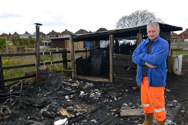 Arson at New England allotments where several chickens were killed, pictured is Graham Walker with the burnt out chicken coop