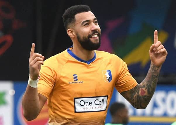 Picture Andrew Roe/AHPIX LTD, Football, EFL Sky Bet League Two, Mansfield Town v Colchester United, One Call Stadium, 10/03/18, K.O 3pm

Mansfield's Kane Hemmings celebrates his goal

Andrew Roe>>>>>>>07826527594