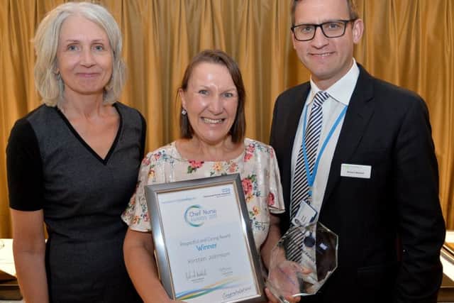 One of last years winners, Kirsten Johnson, with Chief Nurse Suzanne Banks and chief executive Richard Mitchell.