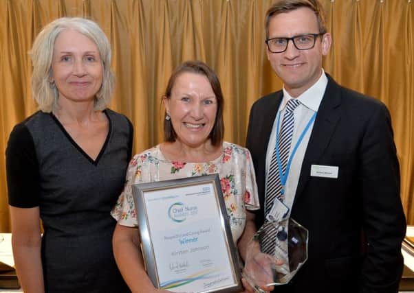 One of last years winners, Kirsten Johnson, with Chief Nurse Suzanne Banks and chief executive Richard Mitchell.