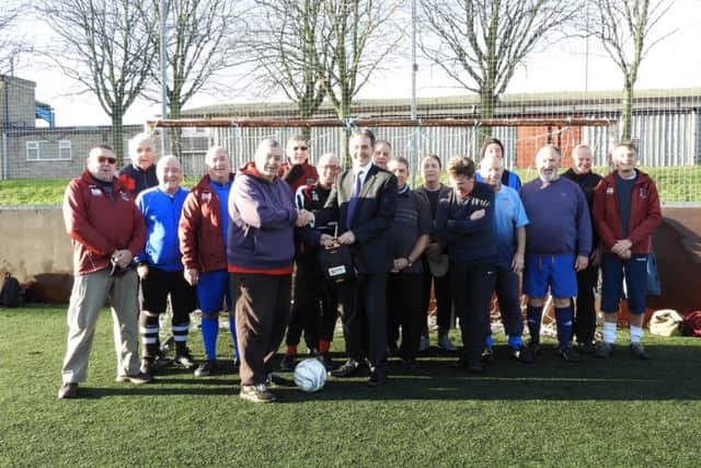 Gev Lynott, Chief Executive and Director at The Mansfield Building Society with The Mansfield Senior Reds Walking Football Club.
