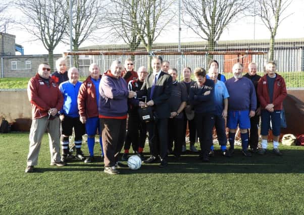 Gev Lynott, Chief Executive and Director at The Mansfield Building Society with The Mansfield Senior Reds Walking Football Club.