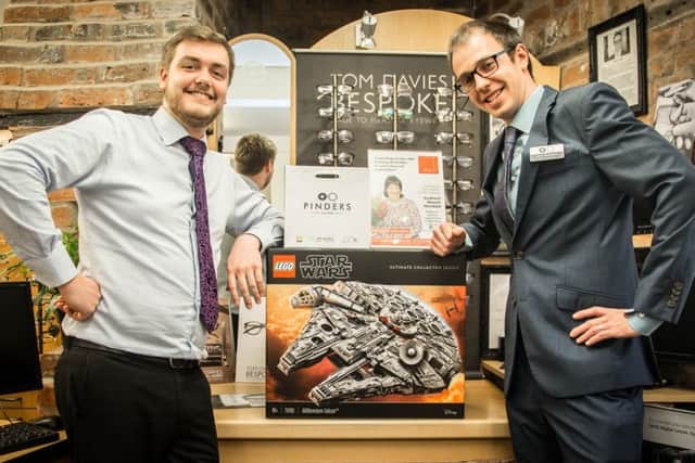 Leon Robson and Peter Herniman, of Pinders Opticians in Southwell, at the launch of the challenge to build a Lego Star Wars Millennium Falcon.