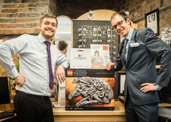 Leon Robson and Peter Herniman, of Pinders Opticians in Southwell, at the launch of the challenge to build a Lego Star Wars Millennium Falcon.