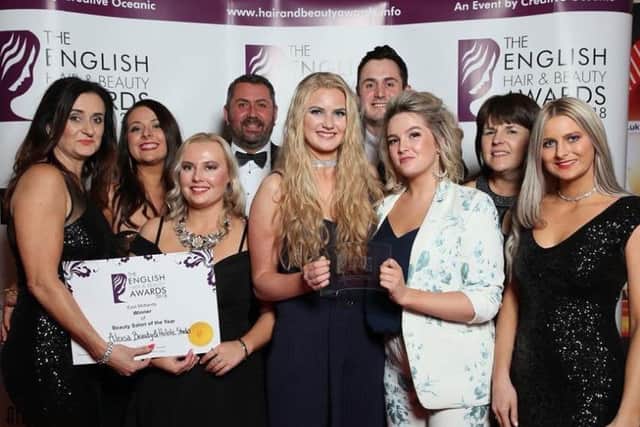 Staff at the Alexsa Beauty and Holistic Studio in Mansfield celebrate their award.