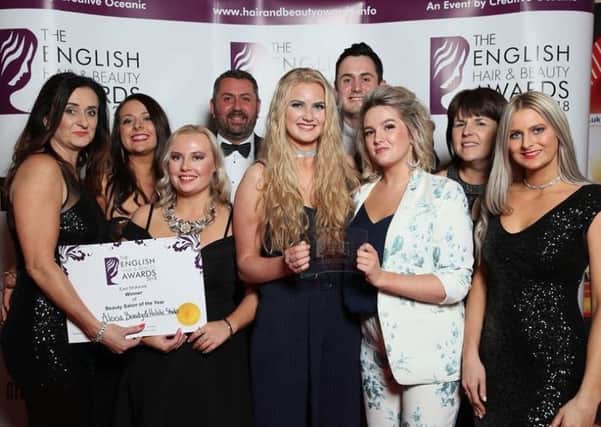 Staff at the Alexsa Beauty and Holistic Studio in Mansfield celebrate their award.