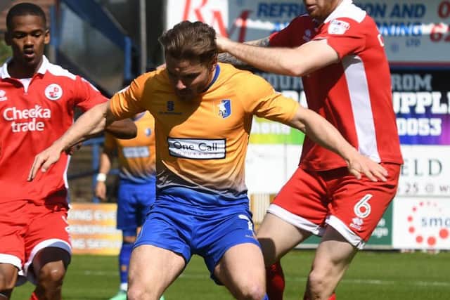Alex MacDonald in action against Crawley.