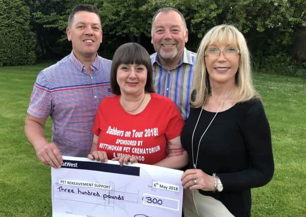 Yvette Price-Mear (red top) receives her sponsorship funding from the Nottingham Pet Crematorium owners John & Rita Harbury-Carlisle and manager Simon Saunders (left). Photo: Robert Rathbone
