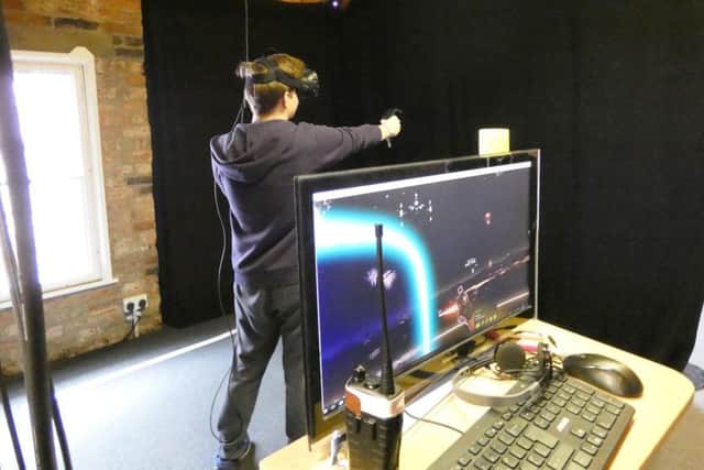 Student Nathan Crossland tries out a virtual reality game