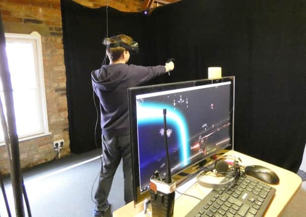 Student Nathan Crossland tries out a virtual reality game