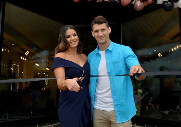 Official opening of K K Hair and Beauty, pictured is Kat Lichaj cutting the ribbon with Husband Eric Lichaj